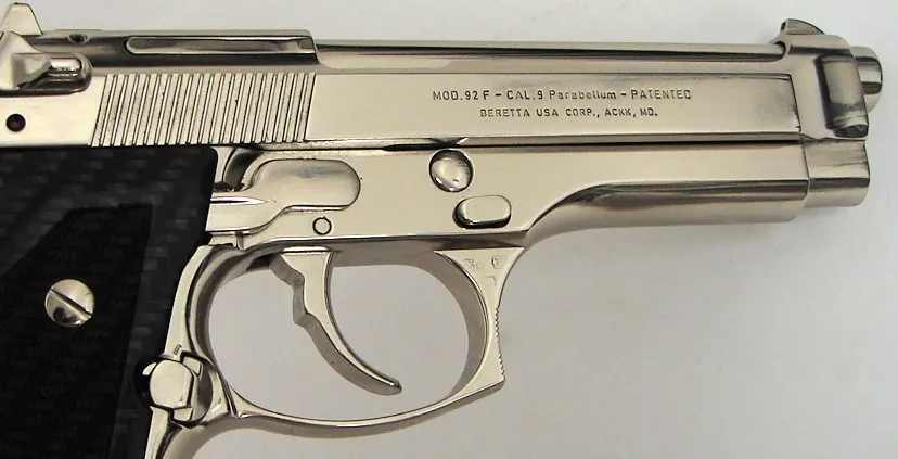 Beretta 92F 9mm para caliber pistol. Italian made model with custom bright nickel finish and blue carbon fiber grips. In excelle (pr13698)