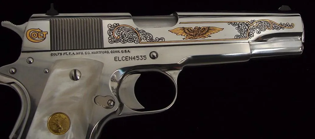Colt Government Model .38 Super caliber pistol. Custom shop model in bright stainless with gold inlay and pearlite grips. New. (c5065)