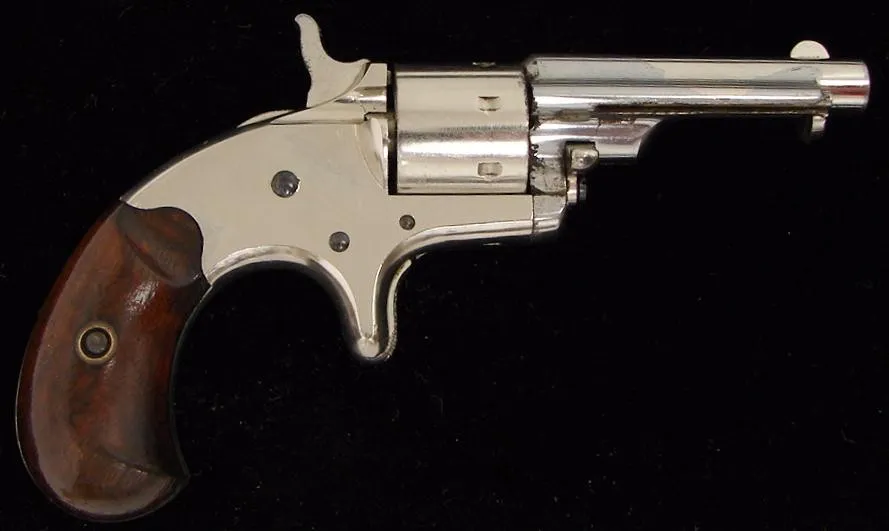 Colt Old Line with ejector .22 caliber revolver. Original factory nickel. Fine grips. Rare model with integral ejector. (c5709)