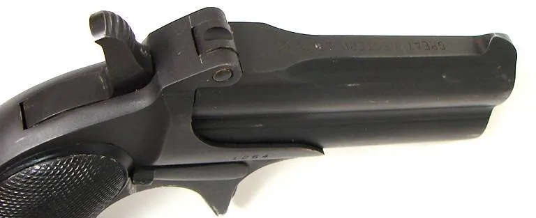 Great Western Arms Derringer .38 S&W caliber pistol. 1950s vintage replica derringer, an early model serial number 12XX. The box (PR15770)