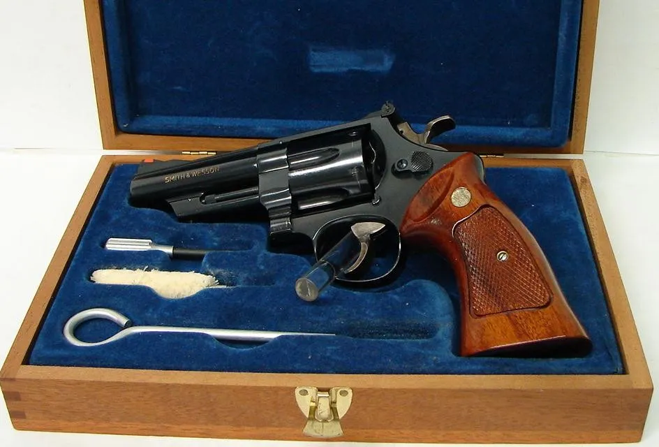 Smith & Wesson 25-5 .45 LC caliber revolver. Very desirable early 4″ blue model with pinned barrel and “N” serial number. Wooden (PR19608)