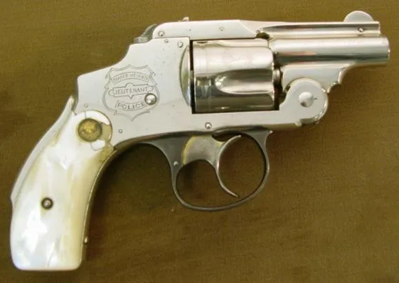 Smith & Wesson D.A. revolver with rare 2 barrel. Factory inscribed and with engraved badge on gun. Medallion pearl grips. (ah1033)
